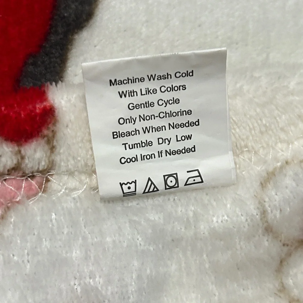 Festive Holiday Blanket with Red and Green Accents used one’s